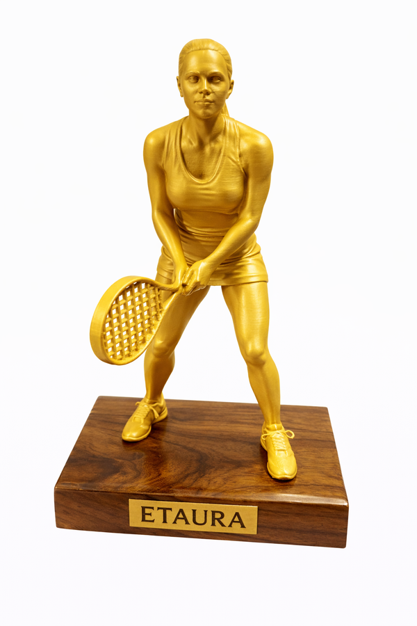 Golden tennis player figurine on teakwood base